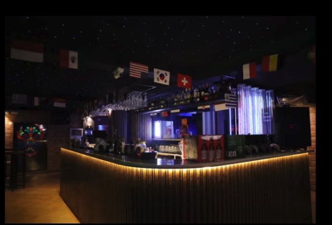 The OFORI bar glowing under neon lights